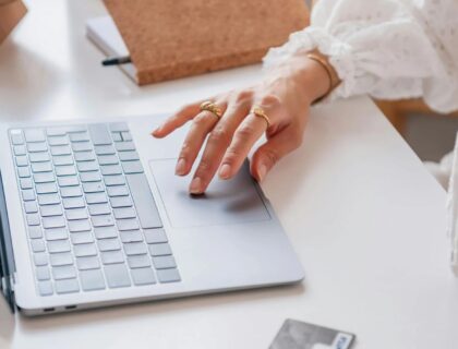 Close Up Shot of a Person Using a Laptop