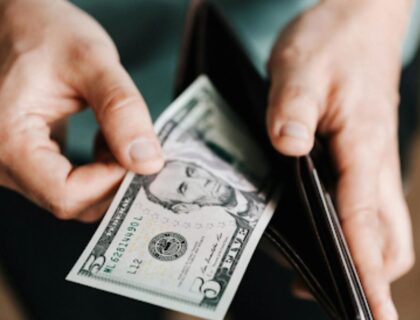 Man holding wallet with money